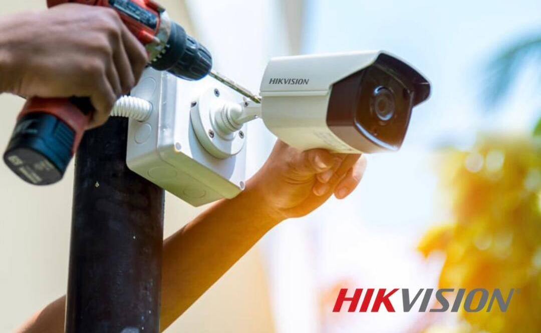 Technician mounting an outdoor bullet camera