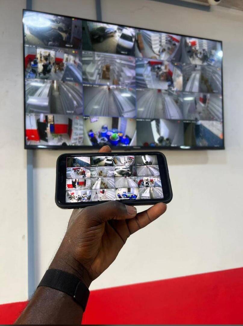 TV wall display and phone showing multi-camera feed