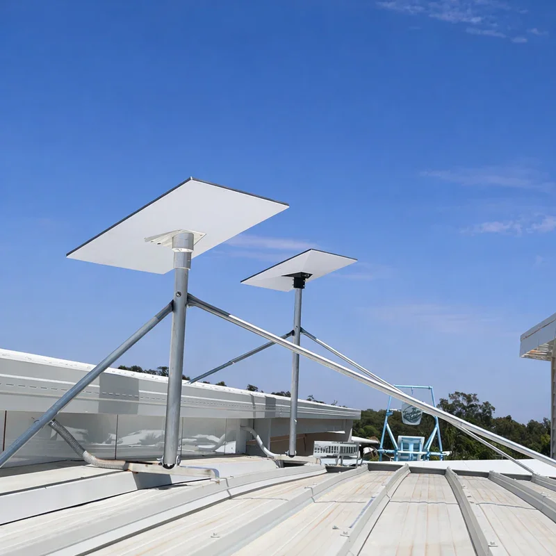 Satellite dishes mounted on a rooftop under a blue sky