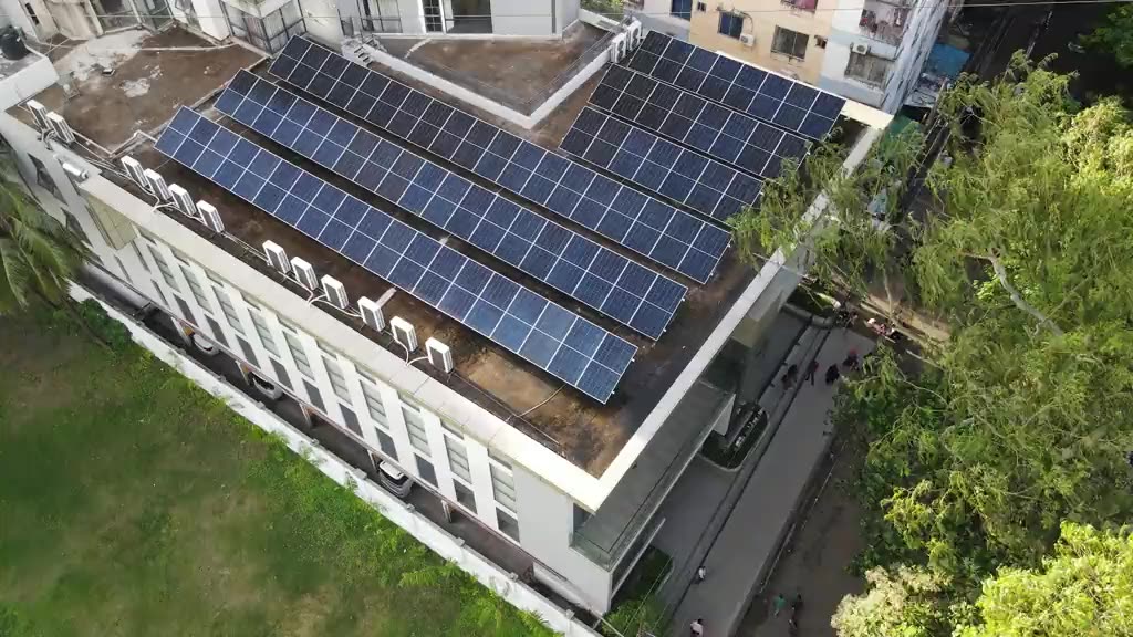 Aerial view of a building roof fitted with solar panels