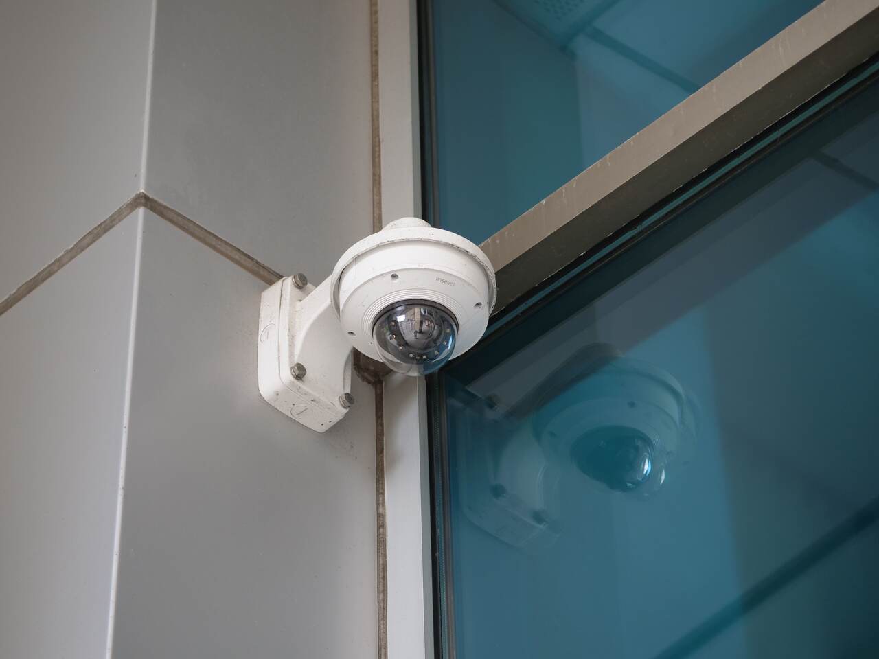 Dome camera mounted on a building corner
