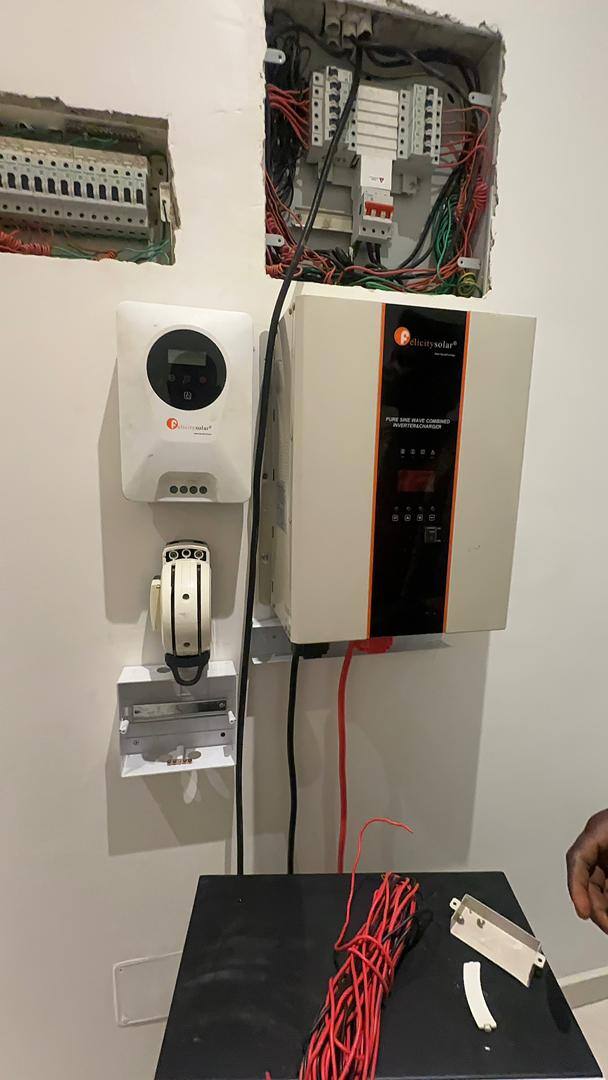 Inverter and panel installation in progress